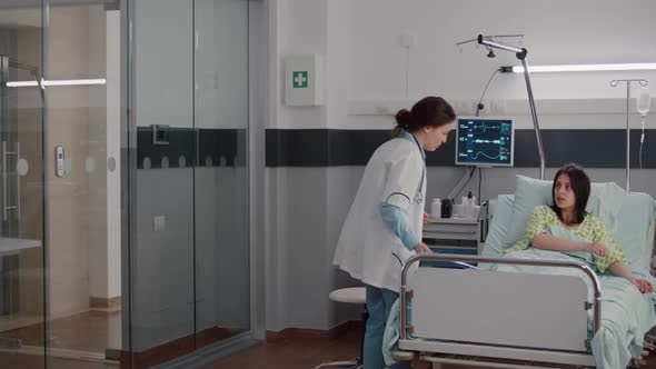 Specialist Doctor Putting Oximeter Checking Pulse Talking with Sick Woman