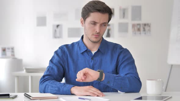 Waiting Young Man Watching Time on Wrist Watch