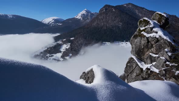 Inverse low clouds holding in a snowy valley in winter frosty time, zoom in / Videohive