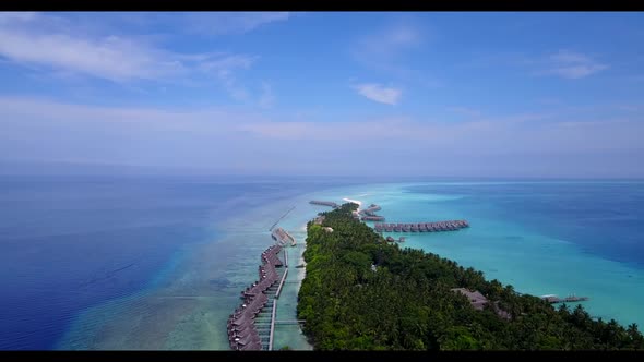 Aerial travel of tropical bay beach lifestyle by blue sea with clean sandy background of a dayout ne