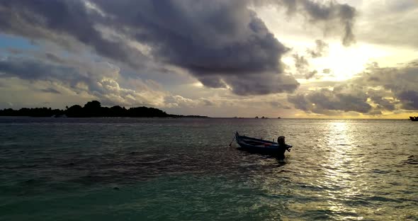 Tropical above tourism shot of a white sand paradise beach and aqua blue water background