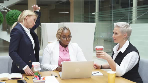 Group of Interracial Business Women Listening To Adult Female Boss, Successful Cooperation 