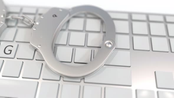 Handcuffs on Keyboard with SPYING Text on Keys