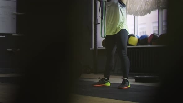 Female Athlete Swinging Kettlebell