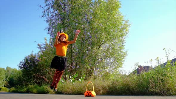 Child Girl in Costume Celebrates Halloween