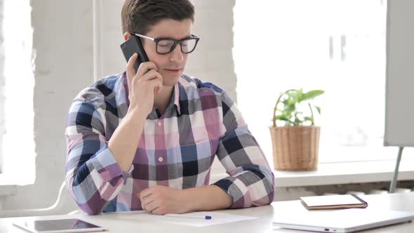 Young Man Talking on Phone