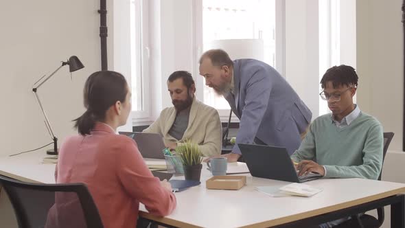 Four Colleagues Having Business Meeting