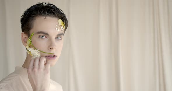 Handsome Young Man with Flowers on Face