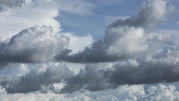 Fast moving time lapse of dramatic clouds in mid afternoon. Weather is typical of summer in the trop