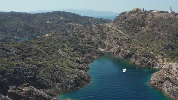 Aerial View of Small Beach Among Rocks of Cape