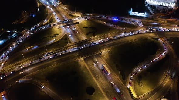 Night Aerial Urban Traffic Road System. Busy Downtown 