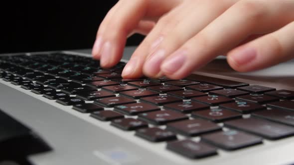 Both Hands of an Office Worker Typing on Keyboard, Front View, Black