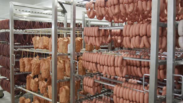 Sausage Production. Sausages Hang on the Shelves Before Baking.