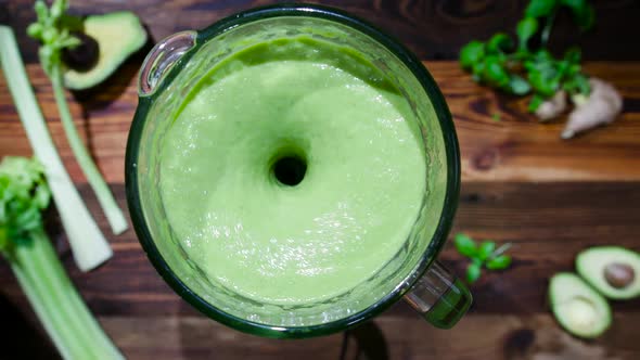 Fresh Green Smoothie in a Blender. The concept of Proper Nutrition for a Healthy Life.