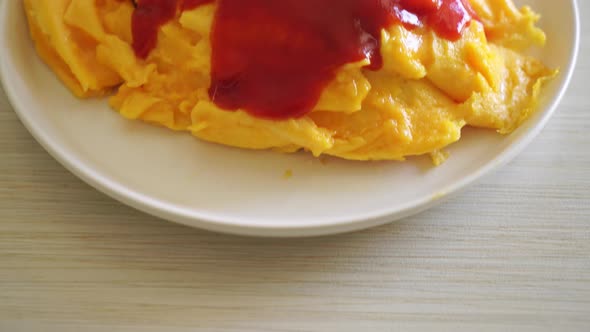 Flavored Fried Rice in an Omelet Wrapping or Omurice in Japanese style - Asian food style