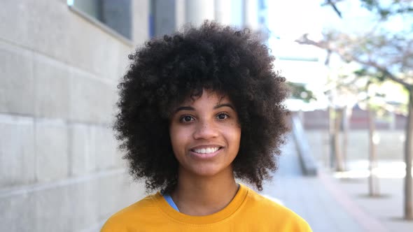 portrait of half a face of one young beautiful cheerful African or American woman