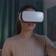 Woman interacting with virtual reality and smiling - VideoHive Item for Sale