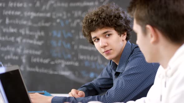 Classmates Talking During IT Lesson