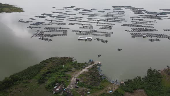 Aerial view of traditional floating fish pond on lake in Indonesia