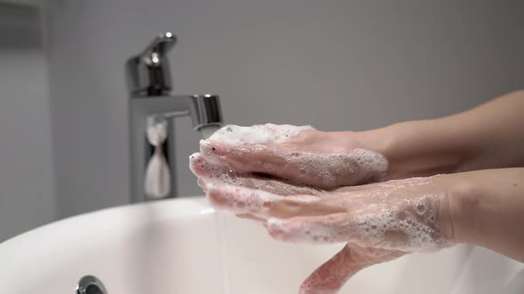 Woman Washes Her Hands