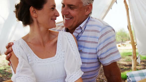 Senior couple sitting under shed 4k