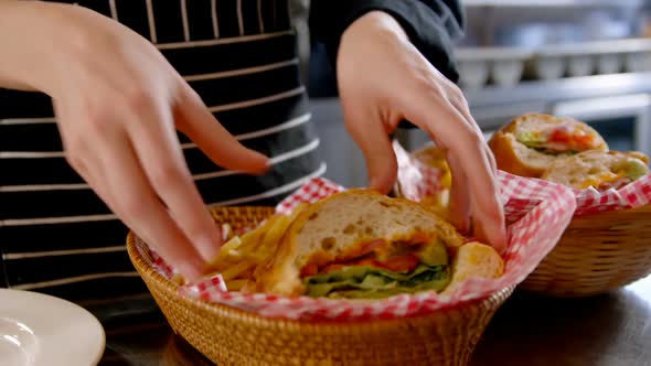 Chef arranging vegetable sandwiches in the basket 4K 4k