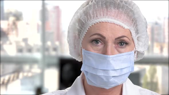 Face of Female Doctor in Surgical Cap.