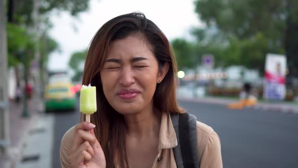 Happy Ethnic Woman with Icecream and Phone on Street