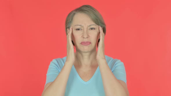 Old Woman with Headache on Red Background