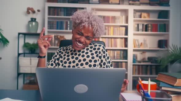 Happy African American Woman Using Laptop Found What She Was Looking for