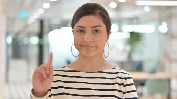 Portrait of Young Indian Woman Saying No By Finger Sign