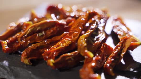 Dried Tomatoes with Olive Oil. Traditional Italian Cuisine