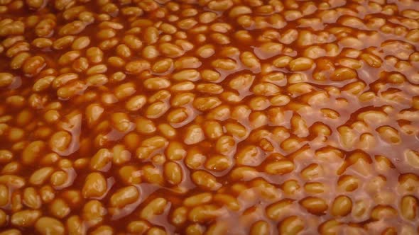 Moving Past Container of Baked Beans