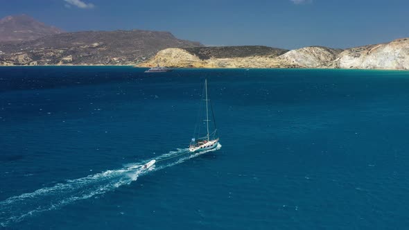 An aerial view of the yacht on the azure sea. Transparent clear water in the Mediterranean Sea.