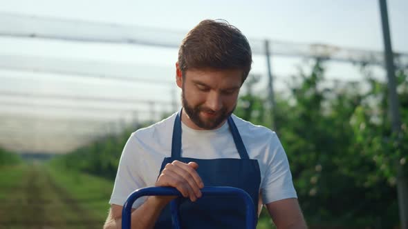 Successful Farmer Man Working on Natural Modern Summer Plantation Field Outdoor