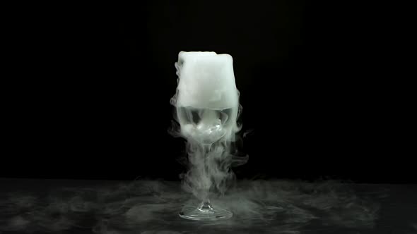 Water in Wine Glass with the Effect of Dry Ice. Slow Motion