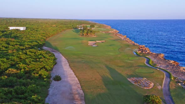 Fly Over Grass-Covered Golf Course Of Costa Campo de Golf At Playa Nueva Romana In Dominican Republi