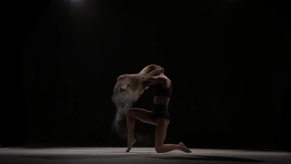 Sporty Dancer Throwing Dust Particles in Air. Slow Motion