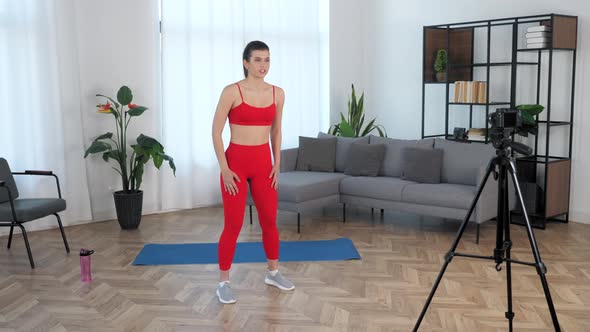 Sport Muscular Girl Tells Teaches Student Records Online Course Lesson on Camera