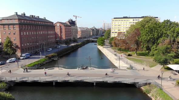 Drone flying over bridge with bicycle in Malmö, Sweden. Daytime, late summer