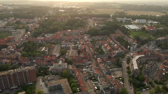 Flying over Leuven Belgium toward open fields