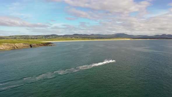 Aerial of Jet Ski Driving on the Atlantic Ocean in Dwoning County Donegal  Ireland