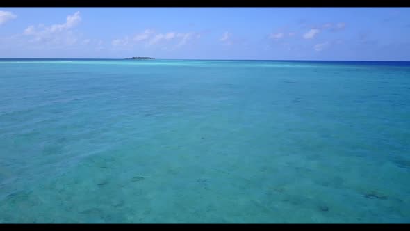 Aerial top down panorama of perfect lagoon beach holiday by blue lagoon with white sandy background 