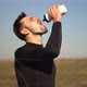 Tired Runner Drinking Water. Triathlete Drinking Isotonic In Running Pause. Runner Relaxing. - VideoHive Item for Sale
