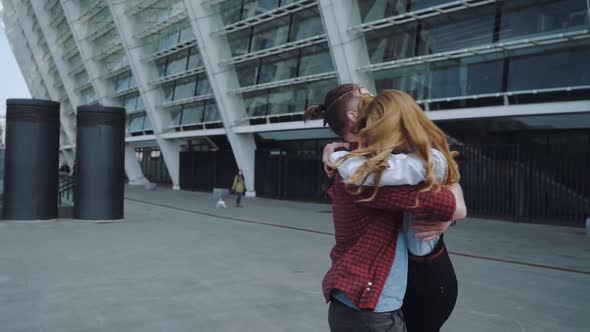 Handsome Bearded Man Hugging His Beautiful Girl on the Street