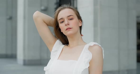 Young Dancer in White Dress Dances on the Stairs of the Theatre in Slow Motion Balerina Does Dance