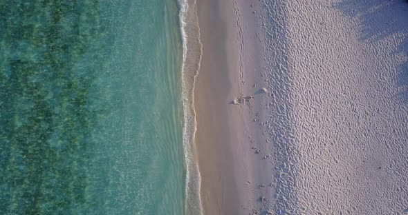 Natural drone abstract view of a sunshine white sandy paradise beach and aqua blue ocean background 