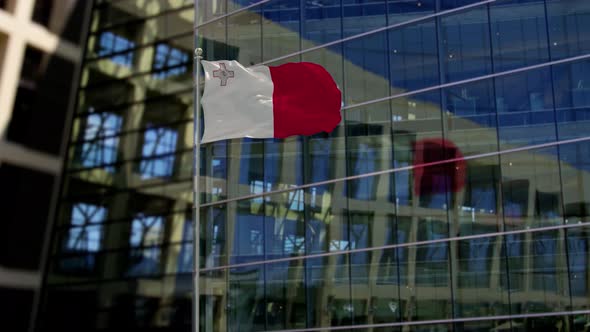 Malta Flag Waving On A Skyscraper Building