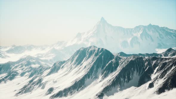 Mountain Winter Caucasus Landscape with White Glaciers and Rocky Peak