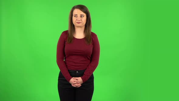 Pretty Girl Worrying in Expectation Then Smiles and Sighs with Relief. Green Screen